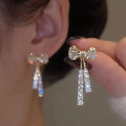 boucles d'oreilles nœud doré strass