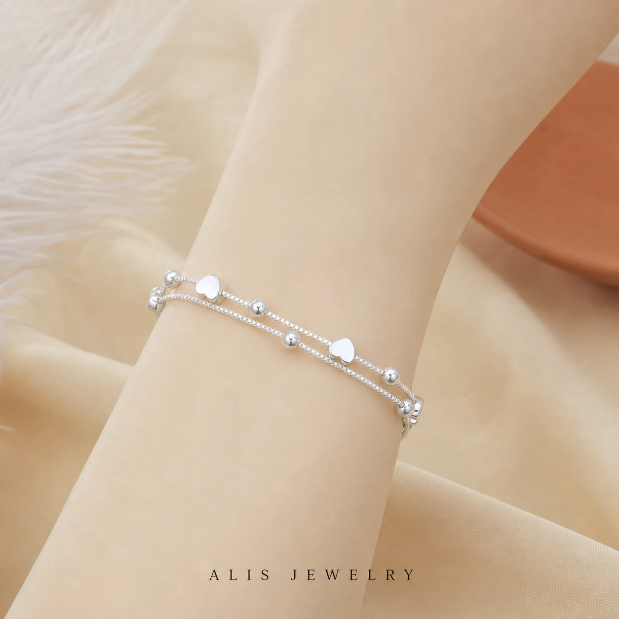 Bracelet chaîne cœur boule couple argent 925 - Alis Jewelry - sur support minéral